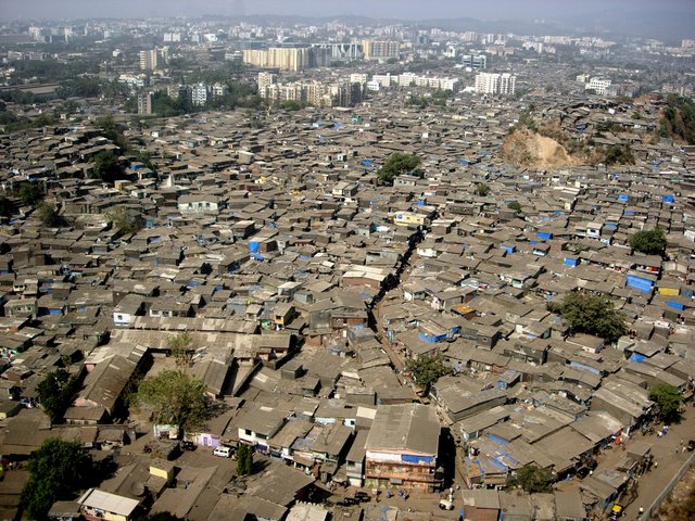 Photo : Le bidonville Dharavi à Bombay (800 000 hab.) Photo : Le bidonville Dharavi à Bombay (800 000 hab.)